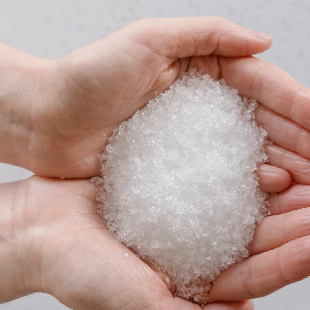 Two cupped hands holding Zea Kunzea Bath Salts